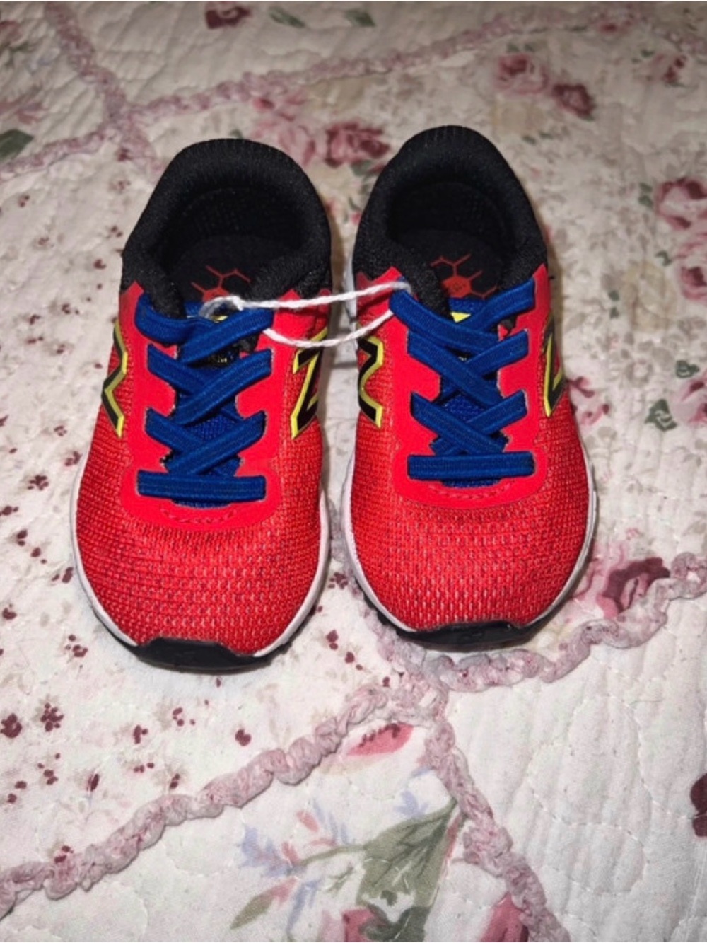 New Balance Kids Red Sneakers with Blue Laces and Yellow Accents